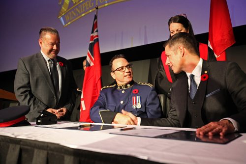 
RUTH BONNEVILLE / WINNIPEG FREE PRESS

Winnipeg new Police Chief Danny Smyth shakes Mayor Bowman's hand after signing the paperwork for the Oath of Office during ceremony  at the Met Tuesday.  
 

November 8,2016