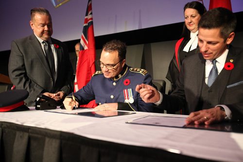 
RUTH BONNEVILLE / WINNIPEG FREE PRESS

Winnipeg new Police Chief Danny Smyth signs the paperwork for the Oath of Office during ceremony  at the Met Tuesday.  
 

November 8,2016