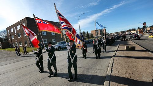 PHIL HOSSACK / WINNIPEG FREE PRESS -  St James Legionaires bear the Colors down Portage avenue after taking part in a Remberance Day Memorial at Bruce Park. See story. November 11, 2016