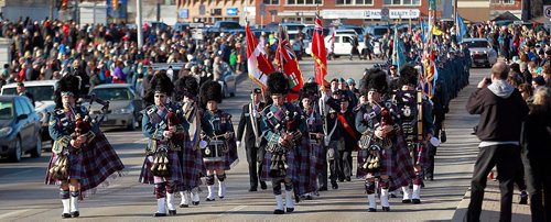 PHIL HOSSACK / WINNIPEG FREE PRESS -  City of Winnipeg 402 Squadron's Pipe and Drum Band leads a parade Down Portage avenue from the Remberance Day Memorial at Bruce Park. See story. November 11, 2016