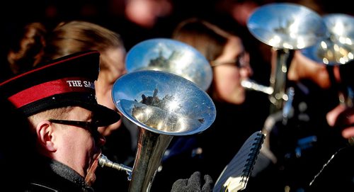 PHIL HOSSACK / WINNIPEG FREE PRESS -  The Cenotaph is reflected in the horns of a Salvation Army Brass Band providing the musical background at the Remberance Day Memorial at Bruce Park. See story. November 11, 2016