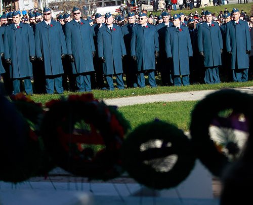 PHIL HOSSACK / WINNIPEG FREE PRESS -  Winnipeg Airmen are framed in wreaths layed at the foot of a Cenotaph during the Remberance Day Memorial at Bruce Park. See story. November 11, 2016
