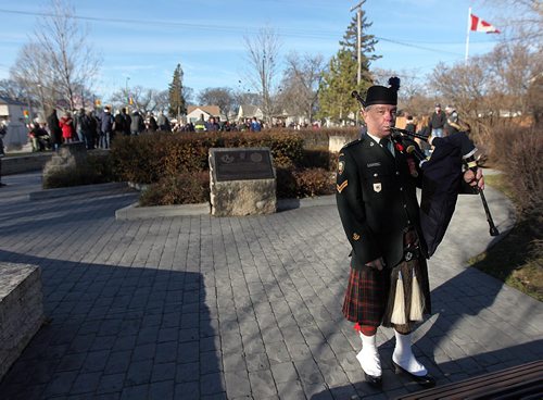 PHIL HOSSACK / WINNIPEG FREE PRESS -  Cpl. Kelly Fitzpatrick tunes his pipes before taking part in the Rememberance Day Memorial at Valour Road and Sargent ave.  See story. November 11, 2016