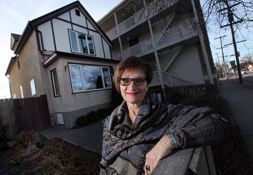 PHIL HOSSACK / WINNIPEG FREE PRESS -  Virginnia Lehotsky, ten years after her husband Harry died poses in front of a "Lazarus" homes rebuilt in the inner city. She lives there now, her son in another next door.  See Kevin Rollason's story. November 11, 2016