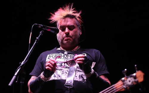 TREVOR HAGAN / WINNIPEG FRESS PRESS
Fat Mike Burkett examines his newly broken glasses as NOFX performs to a sold out crowd at the Burton Cummings Theatre, Friday, November 11, 2016.