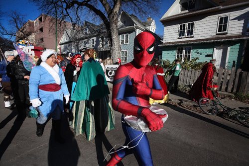 RUTH BONNEVILLE / WINNIPEG FREE PRESS

One of the members of Costume Alliance non-profit group gives the thumbs up while dressed as Spider Man as he waits with others from the group by the Salvation Army Toy Drive Float in the warm sunshine for the start of the Santa Claus Parade Saturday.  
Standup pic
November 12, 2016