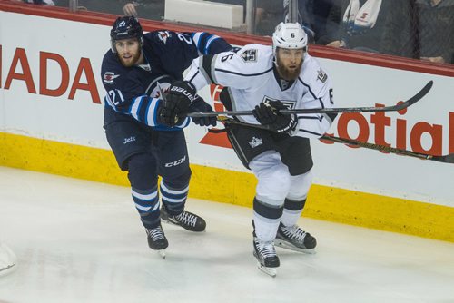 MIKE DEAL / WINNIPEG FREE PRESS
Winnipeg Jets' Quinton Howden (21) and Los Angeles Kings' Jake Muzzin (6) during an afternoon NHL game at MTS Centre Sunday.
161113 - Sunday November 13, 2016