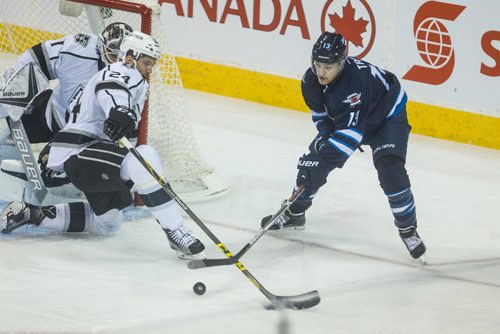 MIKE DEAL / WINNIPEG FREE PRESS
Winnipeg Jets' Brandon Tanev (13) tries to get the puck past Los Angeles Kings' Derek Forbort (24) during an afternoon NHL game at MTS Centre Sunday.
161113 - Sunday November 13, 2016