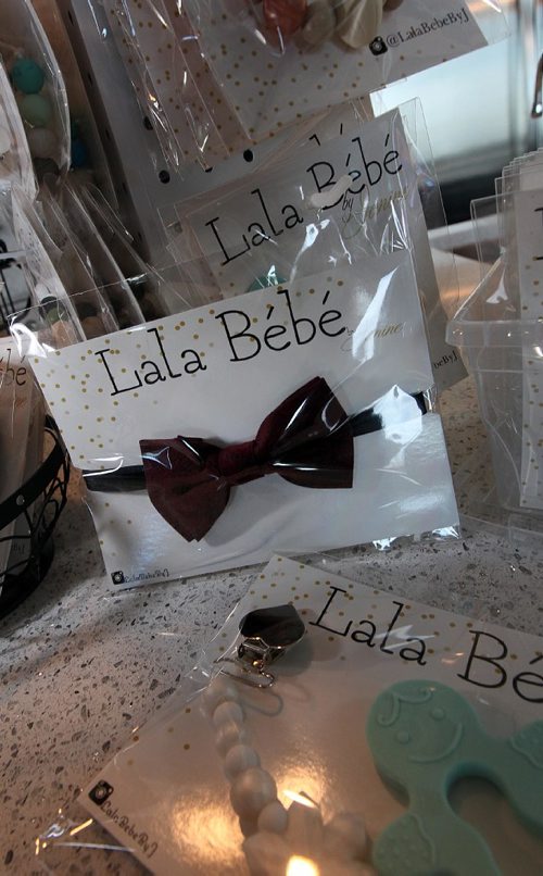 PHIL HOSSACK / WINNIPEG FREE PRESS -  An infant's bow tie is frames by other goods,  all part of Janine Melina Johnson's  hand made "Lala Bebe" infant products. See Connie T.'s story.  November 14, 2016