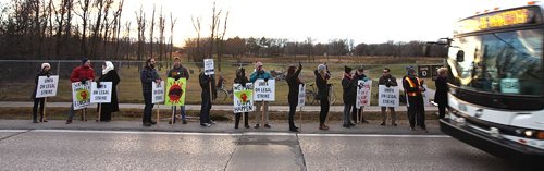 PHIL HOSSACK / WINNIPEG FREE PRESS -  Picketers march and wave to traffic manning a picket line at Univercity Cr and Markham Rd. See story re: strike into 3rd week.  November 14, 2016