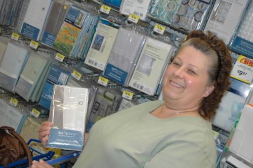 Shelley Seidl, a shopper at a Winnipeg Walmart, shown holding a PVC shower curtain. A report released today by the U.S.-based Centre for Health, Environment and Justice said PVC curtains such as those shown here may be releasing toxic compounds into peoples homes. Ill have to try something else, Seidl said. June 12, 2008. By Will Tremain Winnipeg Free Press