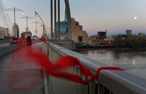 WAYNE GLOWACKI / WINNIPEG FREE PRESS

 Red ribbons to honour and remember Missing and Murdered Indigenous Women and Girls attached to the Provencher Bridge blow in the light breeze Tuesday morning .  Nov. 15 2016