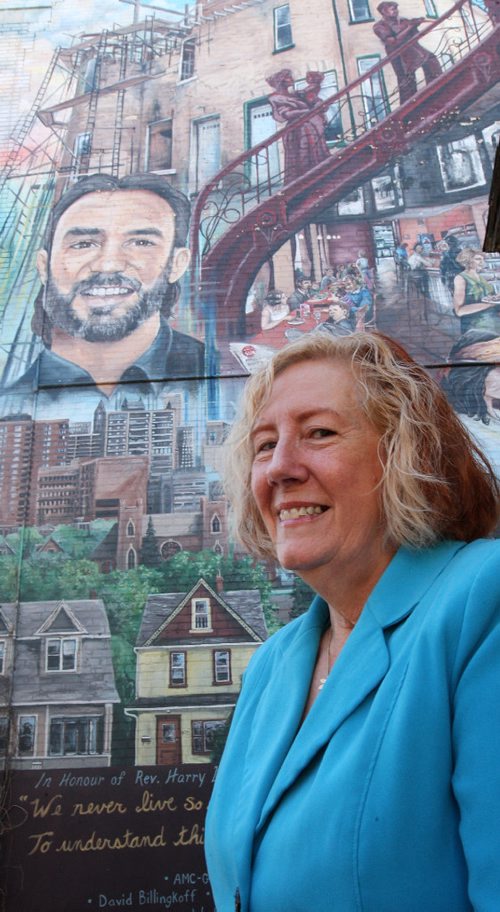 JOE BRYKSA / WINNIPEG FREE PRESS  Trudy Turner poses for photo by the Harry Lehotsky mural on Maryland  that she organized to get completed in 2006-Nov 15, 2016 -( See Kevin Rollason Lehotsky  story)