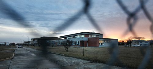 PHIL HOSSACK / WINNIPEG FREE PRESS - The former Officer's Mess at Kapyong Barracks and home to the Second Battalion of the Princess Patricia's Canadian Light Infantry, framed in pagewire fence, sits empty now slated for demolition. See story. November 14, 2016