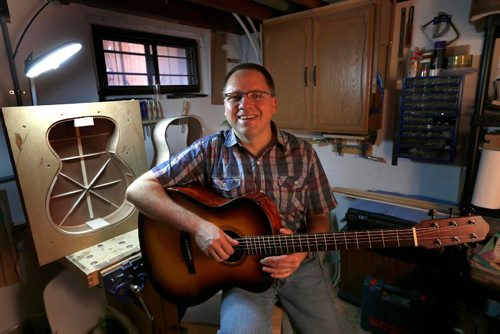 WAYNE GLOWACKI / WINNIPEG FREE PRESS

Faith. Winnipeg minister and guitar builder publishes video songbook of original church music for free downloads. He is holding a guitar he built in the area he also creates his videos.   Brenda Suderman story Nov. 17 2016