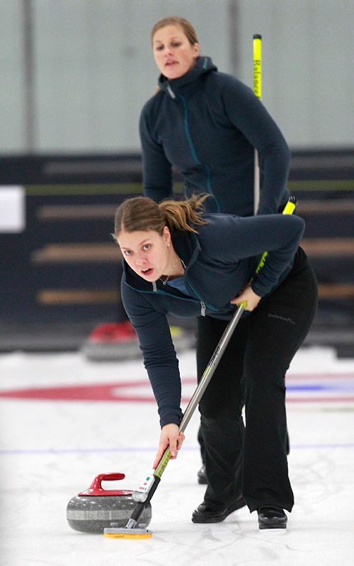 PHIL HOSSACK / WINNIPEG FREE PRESS -  Warming up for the weekend "Super Speil", Swedish lead Maria Wennerstroem sweeps while 2nd Christina Bertrup watches her throw on the practice ice in Morris Thursday afternoon. See Mike Sawatzky's story.  November 17, 201