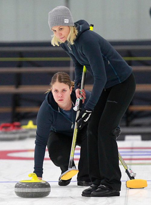 PHIL HOSSACK / WINNIPEG FREE PRESS -  Warming up for the weekend "Super Speil", Lead Maria Wennerstroem throws while Swedish 3rd (who throws skip rock) Cissi Ostlund sweeps up on the practice ice in Morris Thursday afternoon. See Mike Sawatzky's story.  November 17, 201