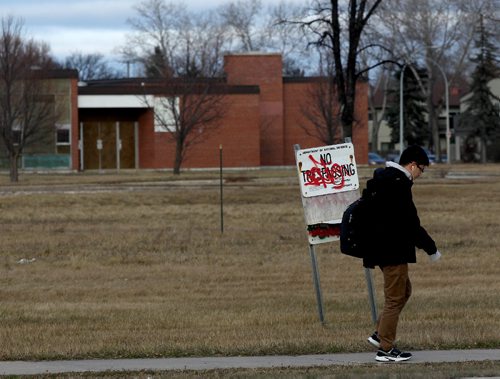 JOE BRYKSA / WINNIPEG FREE PRESS   A passerbye walks by Kapyong Barracks on Grant Ave -vacant since 2004 when the 2nd Battalion, Princess Patricia's Canadian Light Infantry, relocated to CFB Shilo, Manitoba- Buildings as seen after 12 years of being vacant in Winnipeg- Nov 17, 2016 -( See story)