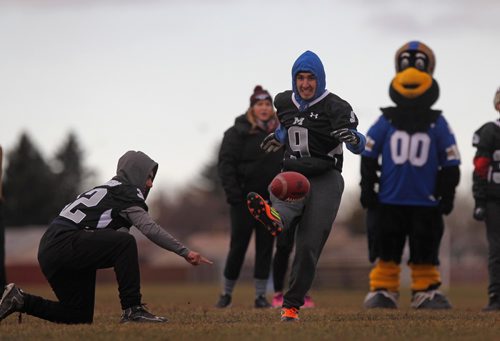 RUTH BONNEVILLE / WINNIPEG FREE PRESS


Maples Collegiate student Matteo Urciuoli kicks the football toward goal posts during a high school football Skills Challenge put on by CFL West team at Maples Collegiate Saturday morning.  (FYI Blue Bomber, Andrew Harris was not at the camp for photo-op with kids).
Standup 
November 19, 2016