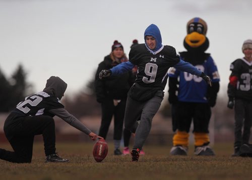 RUTH BONNEVILLE / WINNIPEG FREE PRESS


Maples Collegiate student Matteo Urciuoli prepares to kick the football between goal posts during a high school football Skills Challenge put on by CFL West team at Maples Collegiate Saturday morning.  (FYI Blue Bomber, Andrew Harris was not at the camp for photo-op with kids).
Standup 
November 19, 2016