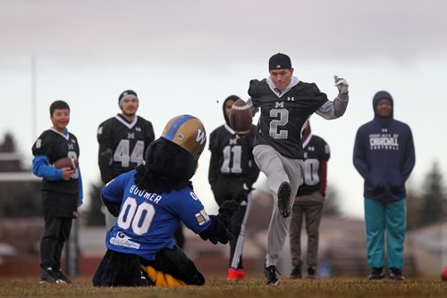 RUTH BONNEVILLE / WINNIPEG FREE PRESS


Blue Bombers mascot Boomer holds football while Maples Collegiate students learn to kick the ball between the goal posts during a high school football Skills Challenge put on by CFL West team at Maples Collegiate Saturday morning.  (FYI Blue Bomber, Andrew Harris was not at the camp for photo-op with kids).
Standup 
November 19, 2016