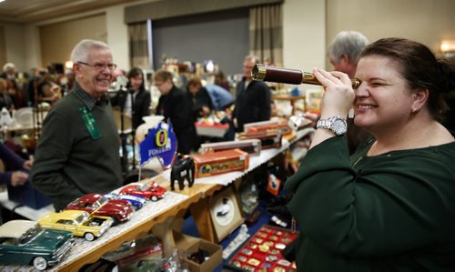 MIKE DEAL / WINNIPEG FREE PRESS

Jessica Reeder (right) checks out an old telescope while owner Rusty Rutherford (left) with Elain's Antiques watches during the Manitoba Antique Association Fall sale at the Viscount Gort Hotel Sunday morning.

161120
Sunday, November 20, 2016