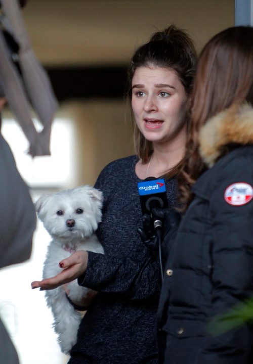 BORIS MINKEVICH / WINNIPEG FREE PRESS
Beatrice Canuel-Desilets, 17, talks to media about what she saw at the house across the street yesterday. She holds her dog named Roxy. To go with story on possible drug overdose at 67 Kinlock Lane, 2 males in medical distress. Nov 21, 2016