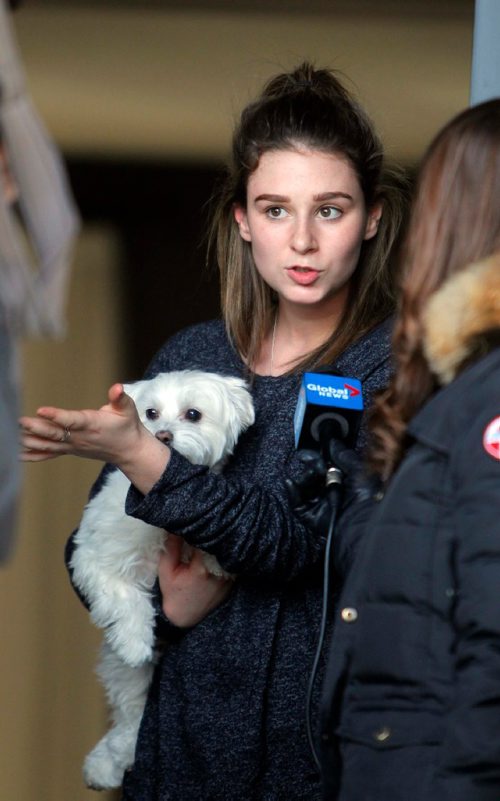 BORIS MINKEVICH / WINNIPEG FREE PRESS
Beatrice Canuel-Desilets, 17, talks to media about what she saw at the house across the street yesterday. She holds her dog named Roxy. To go with story on possible drug overdose at 67 Kinlock Lane, 2 males in medical distress. Nov 21, 2016