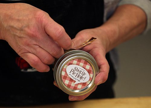 PHIL HOSSACK / WINNIPEG FREE PRESS -  Sut Ur Pie Hole.....Labels lovingly applied by hand, Shut Ur Pie Hole's makes Canned pies and more, see Dave Sanderson's story.  November 21, 201