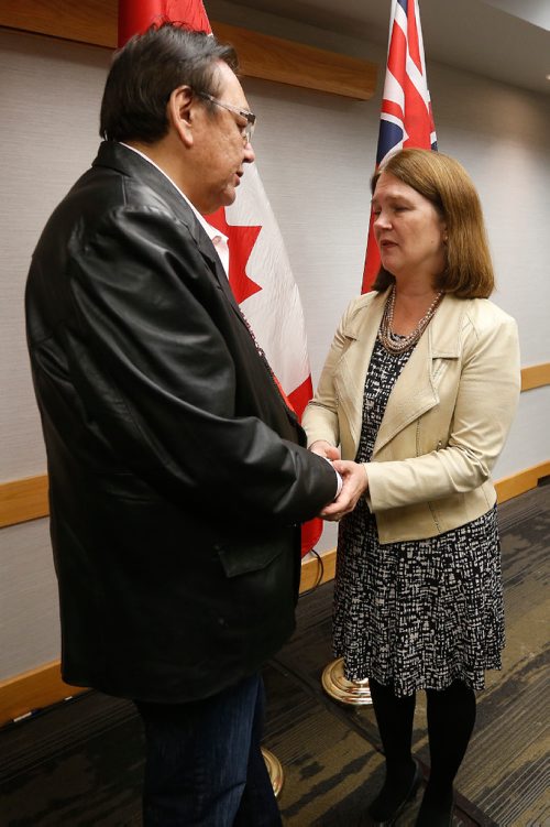 JOHN WOODS / WINNIPEG FREE PRESS
Jane Philpott, Federal Minister of Health, speaks to Eric Robinson, spokesperson for the switched at birth families after a press conference  at Inn At The Forks Monday, November 21, 2016.