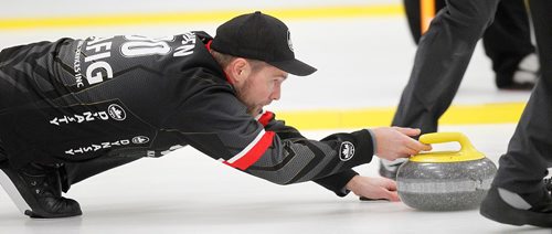 PHIL HOSSACK / WINNIPEG FREE PRESS - Mike McEwen glares down ice as he delivers his rock late in the game Monday evning in Morris at the Decalb Superspeil. See story. November 21, 201