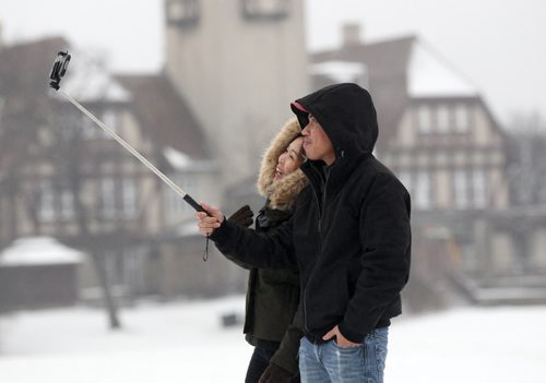 JOE BRYKSA / WINNIPEG FREE PRESS Ryan Salipot and his wife Sheila Salipot take a selfie in Assiniboine Park- Ryan met his wife in the Philippines and the two recently were married- Today was Sheilas first snow- Nov 22, 2016 -( Standup photo)