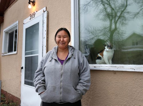 WAYNE GLOWACKI / WINNIPEG FREE PRESS

Liza Feaver in front of the house she lives in.  This is  for a story on a United Way partner agency called SEED.  Feaver was homeless and SEED is an agency that offers support and resources for people in low income situations.  Alex Paul story Nov. 23 2016