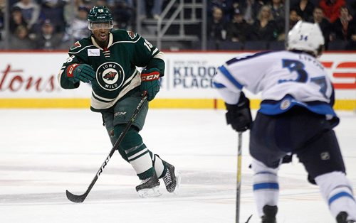 PHIL HOSSACK / WINNIPEG FREE PRESS -  Former Moose now Iowa Wild #18 Maxime Fortunus calls the shots Wednesday evening at the MTS Centre. See story. November 23, 201