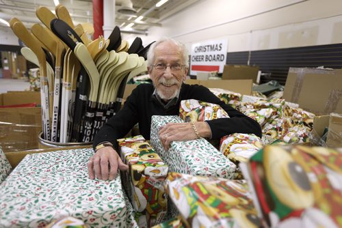 JASON HALSTEAD / WINNIPEG FREE PRESS

Christmas Cheer Board executive director Kai Madsen checks out some of the presents wrapped at the charitable groups warehouse near Polo Park on Nov. 25, 2016.