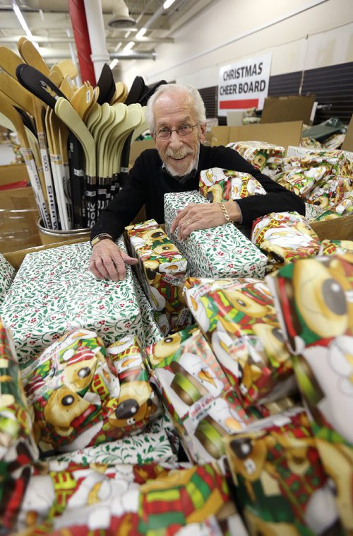 JASON HALSTEAD / WINNIPEG FREE PRESS

Christmas Cheer Board executive director Kai Madsen checks out some of the presents wrapped at the charitable groups warehouse near Polo Park on Nov. 25, 2016.
