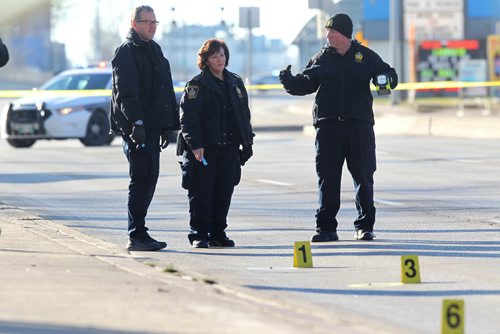 RUTH BONNEVILLE / WINNIPEG FREE PRESS

Police Identification officers investigate shooting scene on  Stradbrook Ave where 6 shot were fired at a vehicle around 3am Saturday morning sending two people to the hospital. Donald street north bound has markers on it identifying ammunition shells from shooting.  

Nov 26, 2016
