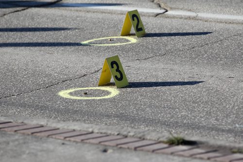 RUTH BONNEVILLE / WINNIPEG FREE PRESS

Police Identification officers investigate shooting scene on  Stradbrook Ave where 6 shot were fired at a vehicle around 3am Saturday morning sending two people to the hospital.
 Donald street north bound has markers on it identifying ammunition shells from shooting.  

Nov 26, 2016

