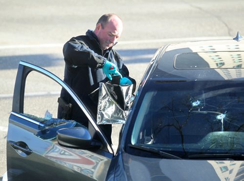 RUTH BONNEVILLE / WINNIPEG FREE PRESS

A Winnipeg Police Identification officer takes a cell phone out of the car that was shot at while  investigating a shooting  on  Stradbrook Ave where 6 shot were fired at a vehicle around 3am Saturday morning sending two people to the hospital.

Nov 26, 2016
