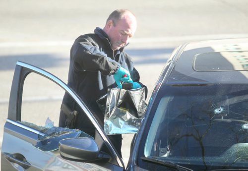 RUTH BONNEVILLE / WINNIPEG FREE PRESS

A Winnipeg Police Identification officer takes a cell phone out of the car that was shot at while  investigating a shooting  on  Stradbrook Ave where 6 shot were fired at a vehicle around 3am Saturday morning sending two people to the hospital.

Nov 26, 2016
