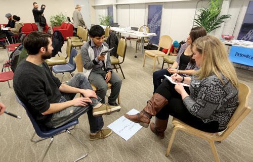 TREVOR HAGAN / WINNIPEG FREE PRESS
Hazim Ismail, second from left, led a discussion group about International Student Experiences during workshops hosted by 13 Fires at Winnipeg at Winnipeg Harvest about racism in housing, Saturday, November 26, 2016.