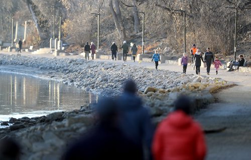 TREVOR HAGAN / WINNIPEG FREE PRESS
People walk along the River Walk near The Forks, Saturday, November 26, 2016.