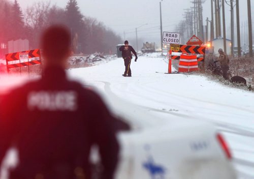 WAYNE GLOWACKI / WINNIPEG FREE PRESS


 RCMP officers and a police dog search a section on Raleigh Rd. and Foxgrove Ave.¤Monday morning¤after a man and woman were shot earlier. The RCMP have closed off road access to the area.¤November 28 2016
