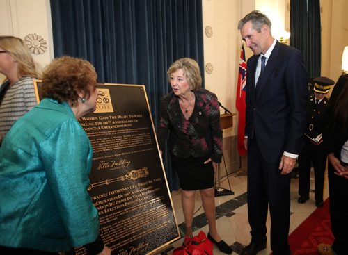 RUTH BONNEVILLE / WINNIPEG FREE PRESS


Premier Brian Pallister, Lieutenant Governor of Manitoba Janice  Filmon and The Nellie McClung Foundation Board Chair Lila Goodspeed (left, green) look at the official plaque commemorating the 100th Anniversary of some Manitoba women receiving the right to vote after it was unveiled at a ceremony at the Legislative BuildingTuesday. 

Nov 29, 2016
