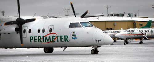 WAYNE GLOWACKI / WINNIPEG FREE PRESS
At left, a plane taxis out from  Perimeter Aviation on Ferry Rd. Kevin Rollason story November 30 2016