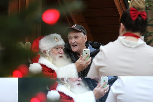 RUTH BONNEVILLE / WINNIPEG FREE PRESS


Kids young and old enjoy visiting with Santa.  Eighty six-year-old Ralph Tessier, an old friend of  Kris Kringle, has his picture taken with him siting on his lap at Polo Park's Santa display Wednesday.
Standup  
Nov 30, 2016
