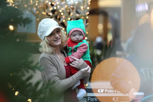 RUTH BONNEVILLE / WINNIPEG FREE PRESS


Jessica Goulet holds her little elf, six-month-old  Kauson waiting in line to have his picture taken with Santa at Polo Park's Santa display Wednesday.
Standup  
Nov 30, 2016
