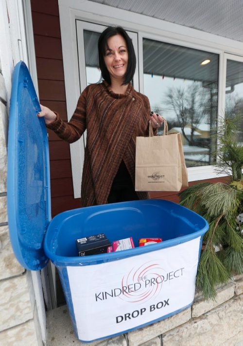 WAYNE GLOWACKI / WINNIPEG FREE PRESS
Jackie Hunt has started a new initiative called the Kindred Project that will help address the need for menstrual hygiene products.   She is with a donation bin in front her parents home in St.James and is holding bags of items that will be given to women.  Jen Zoratti  story  Dec. 1 2016