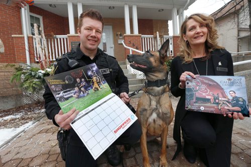 WAYNE GLOWACKI / WINNIPEG FREE PRESS
Winnipeg Police Const. T.J. Spruyt with the K-9 Unit by his dog Xandra and Wendy Galagan CEO, Ronald McDonald House Charities Manitoba at the launch of the 2017 Winnipeg Police Service Canine Unit Calendar.  All proceeds from the sale of the calendar that cost only $15.00 will be donated to Ronald McDonald House Charities® Manitoba. At the event at the Ronald McDonald House Thursday an initial donation of $7500.00 was presented to the charity. 
See police news release   Dec. 1 2016