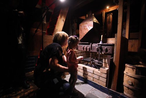 RUTH BONNEVILLE / WINNIPEG FREE PRESS


21/2 year-old Stella Behrendt gets a sneak peek with her Grandmother, Charlene Slingsby, below the Nonsuch at the Manitoba Museum into the mysterious cargo hold area below the deck of the boat.  It  houses not only the ships stove used for cooking and heat during that maiden voyage to James Bay but also bunk areas for the crew.  The Christmas season is  the one time of year it is open for tours  to the public to climb down below the deck of the replica of the 17th-century ship that sailed to Hudson Bay in 1668 in the first trading voyage for what was to become the Hudson's Bay Company two years later.  The museum tours take place Saturdays and Sundays in December and every day throughout the winter holiday between 1:00 and 4:00 pm.
Standup photo 
Nov 30, 2016
